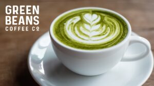 7b6688ca-d0c5-7f74-6862-05a040461428 Matcha Latte with Green Beans Coffee logo